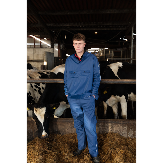 blue Wawets Unisex Milking Top worn on a farm 