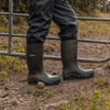 lifestyle image of the Xpert Swampmaster Pro Champion+ Non-Safety Wellington in use on a farm 